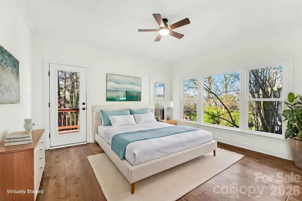 a view of small space with wooden floor and a window