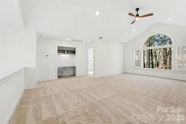 a view of an empty room with windows