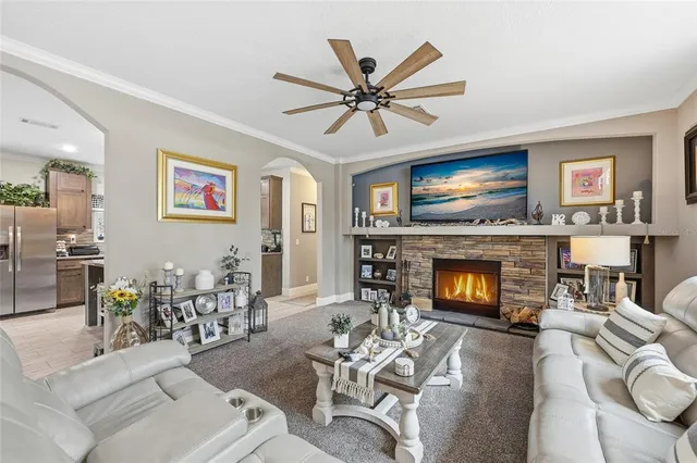 a kitchen with stainless steel appliances granite countertop a sink a stove and a center island
