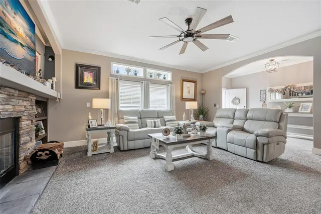 a kitchen with stainless steel appliances kitchen island granite countertop a sink cabinets and wooden floor