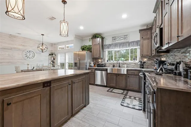 a living room with furniture a air conditioner vent and a window