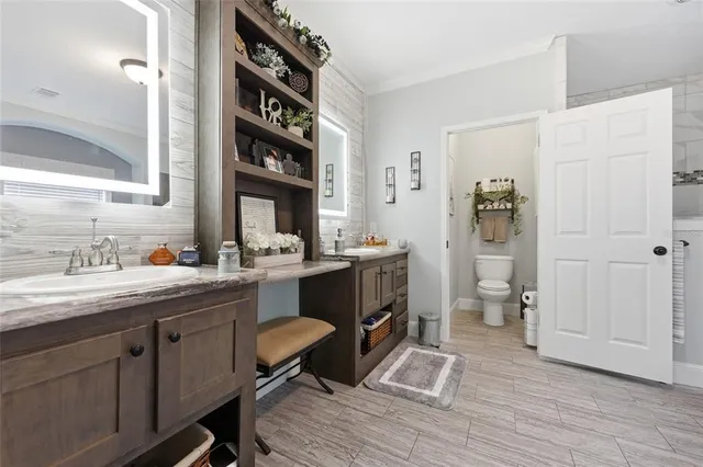 a bedroom with a bed next to a window