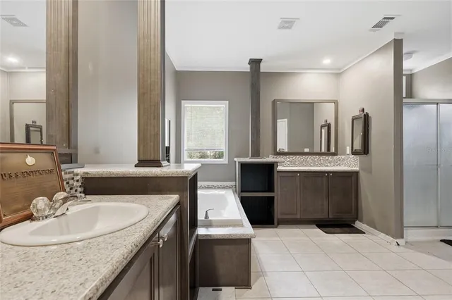 a bathroom with a sink a toilet a shower and curtain