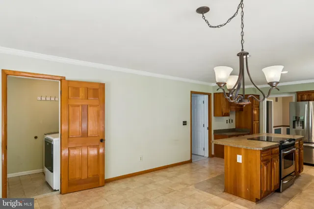 a view of an empty room with a fireplace