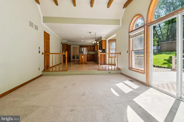 an empty room with wooden floor