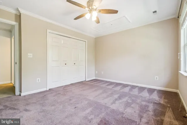 a bathroom with a sink a toilet a mirror and shower
