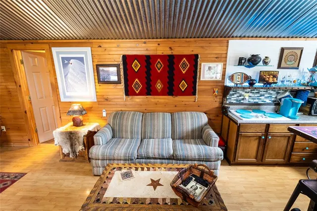 a outdoor living space with furniture and a flat screen tv