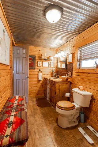 a bedroom with furniture and a wooden floor