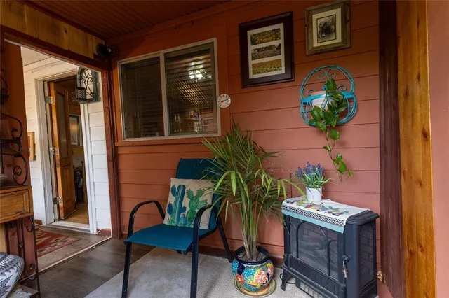 a wooden bench sitting in the middle of a yard