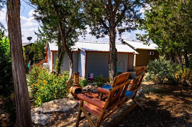 a view of a field with an ocean view