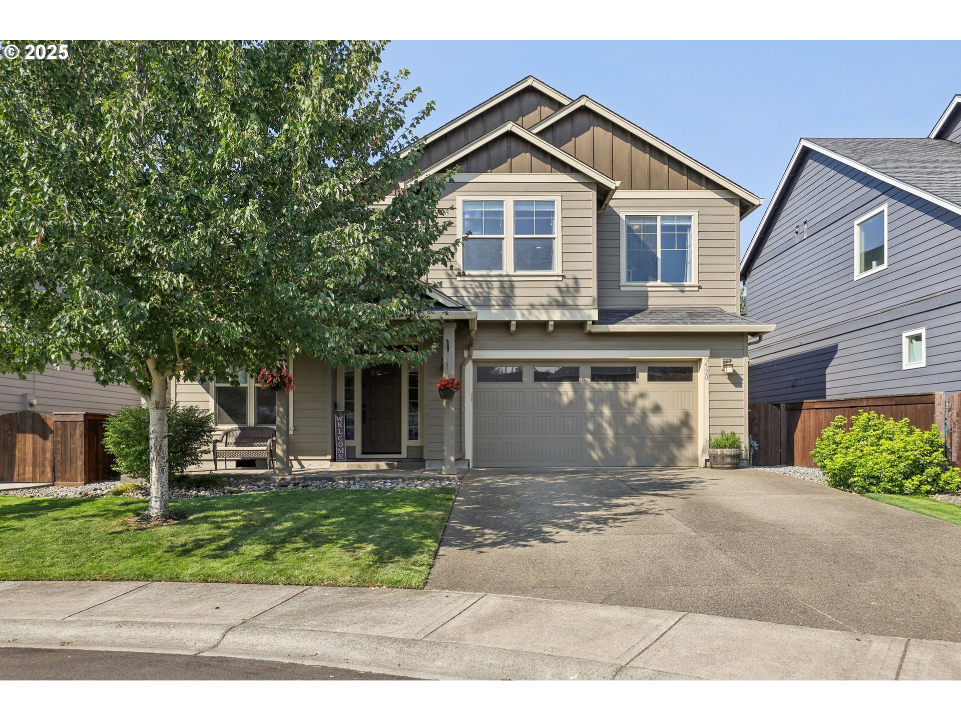 3520 North 6th Circle Ridgefield, WA 98642 - Photo 1 of 27 a front view of a house with a yard and garage
