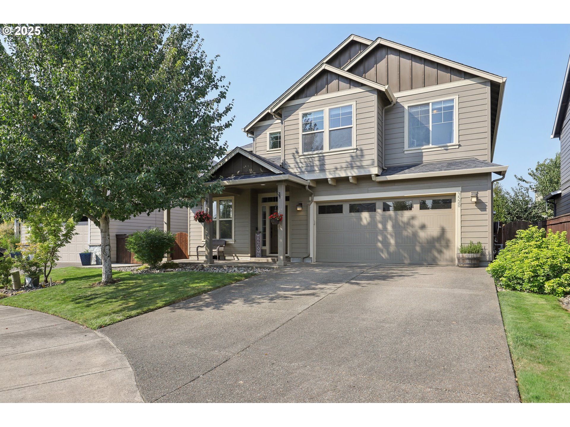 3520 North 6th Circle Ridgefield, WA 98642 - Photo 2 of 27 a front view of a house with a yard and garage