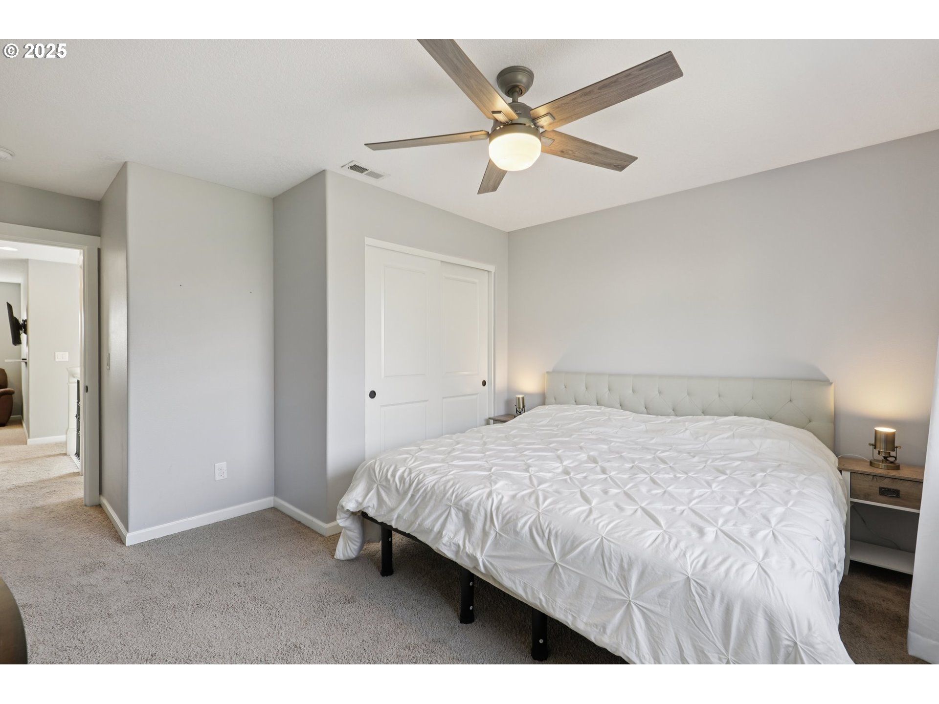 3520 North 6th Circle Ridgefield, WA 98642 - Photo 24 of 27 a bedroom with a bed and a ceiling fan