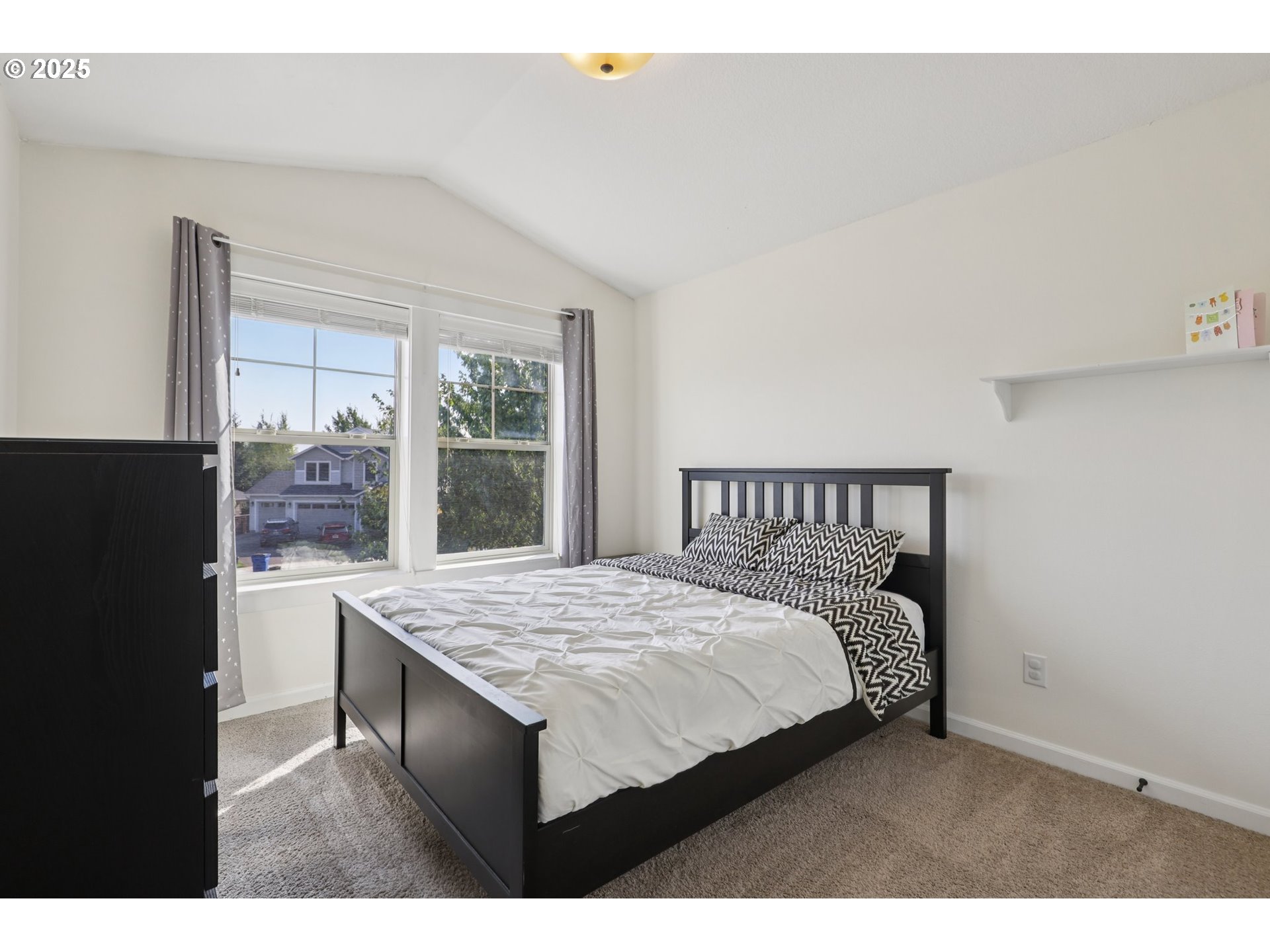 3520 North 6th Circle Ridgefield, WA 98642 - Photo 26 of 27 a bedroom with a bed and a table