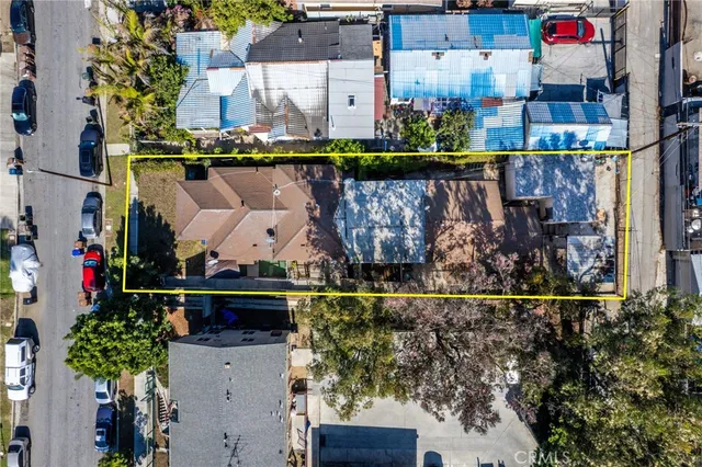 an aerial view of a house with outdoor space