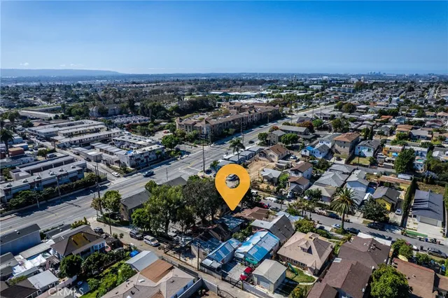 an aerial view of a residential houses with street