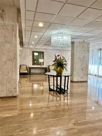 a lobby with furniture and window