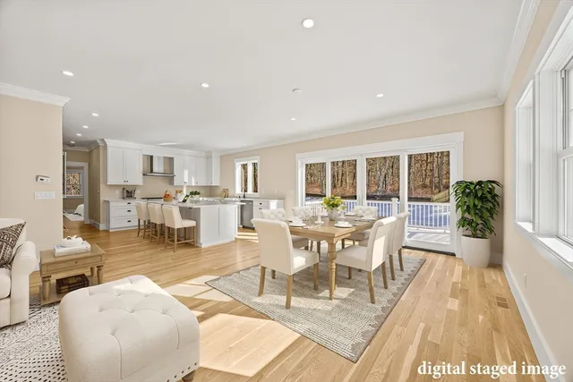 a living room with lots of furniture and a wooden floor