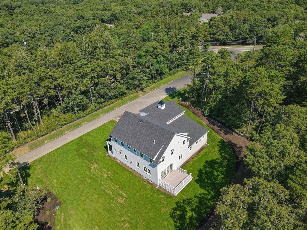 1025 Orleans Road Harwich, MA 02645 - Photo 13 of 39 an aerial view of a house with a yard