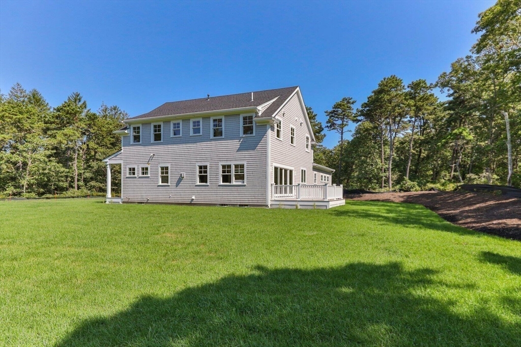 1025 Orleans Road Harwich, MA 02645 - Photo 20 of 39 a view of a house with a big yard