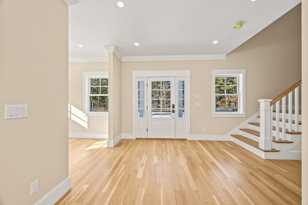 1025 Orleans Road Harwich, MA 02645 - Photo 22 of 39 a view of empty room with wooden floor and windows