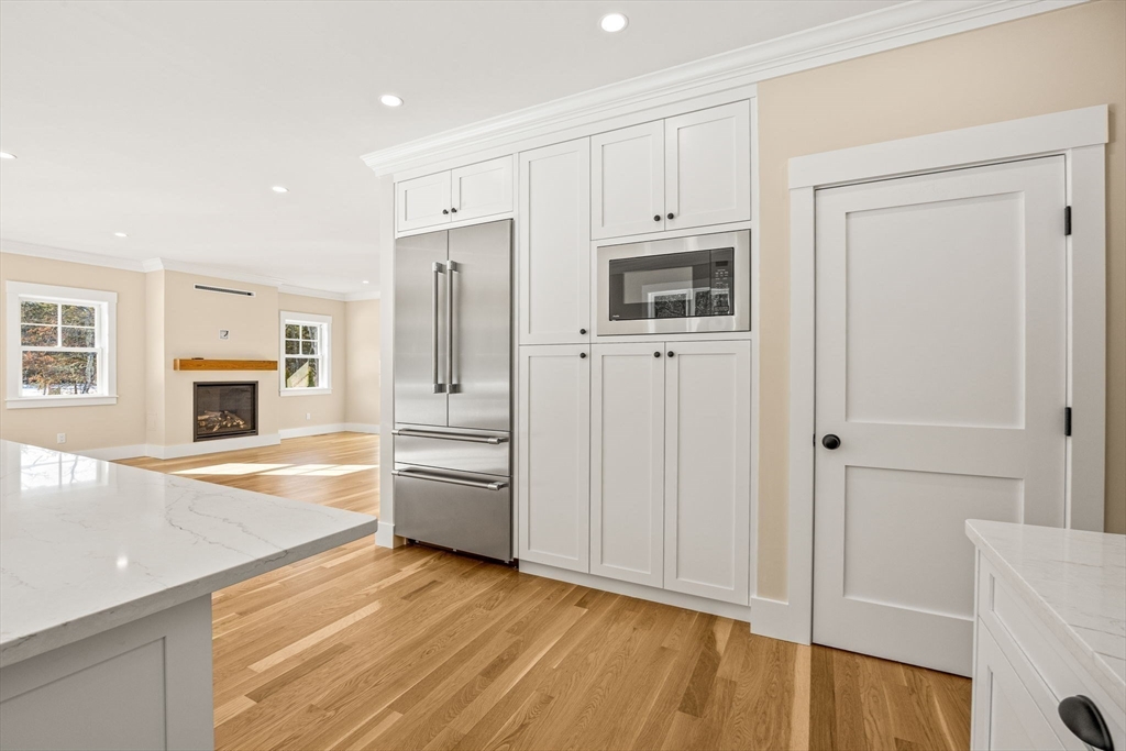 1025 Orleans Road Harwich, MA 02645 - Photo 24 of 39 a kitchen with stainless steel appliances granite countertop a refrigerator and a stove top oven