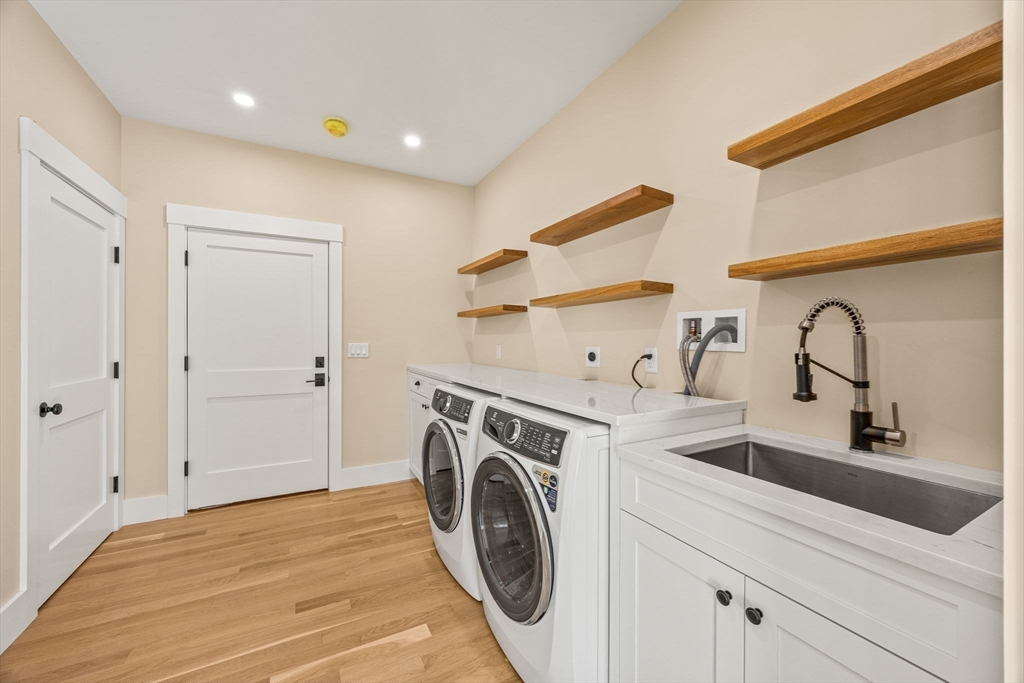 1025 Orleans Road Harwich, MA 02645 - Photo 25 of 39 a utility room with sink dryer and washer