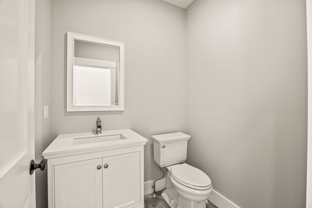1025 Orleans Road Harwich, MA 02645 - Photo 27 of 39 a bathroom with a sink toilet and a mirror
