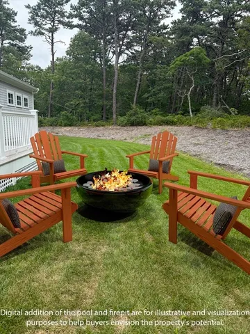 a view of a chairs and table in the garden