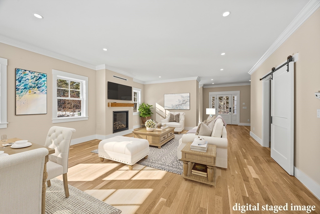 1025 Orleans Road Harwich, MA 02645 - Photo 9 of 39 a living room with fireplace furniture and a wooden floor