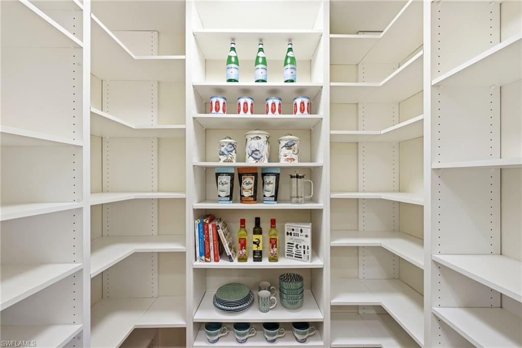 2274 Queens Way Naples, FL 34112 - Photo 12 of 32 Kitchen pantry is spacious with adjustable shelves.