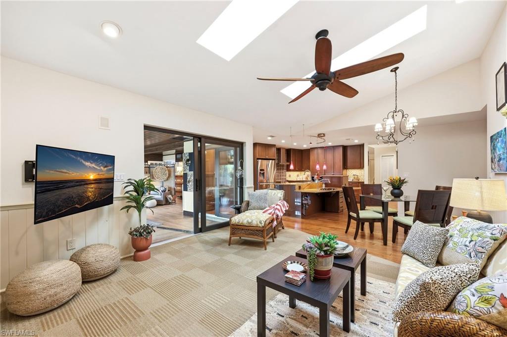 2274 Queens Way Naples, FL 34112 - Photo 13 of 32 Light and Bright gathering room. Hurricane impact skyllights.