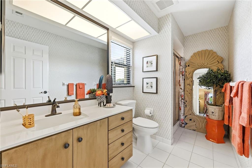 2274 Queens Way Naples, FL 34112 - Photo 29 of 32 a bathroom with a sink toilet and shower