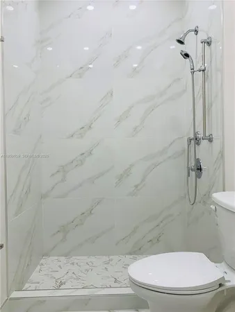 a bathroom with a sink mirror and vanity