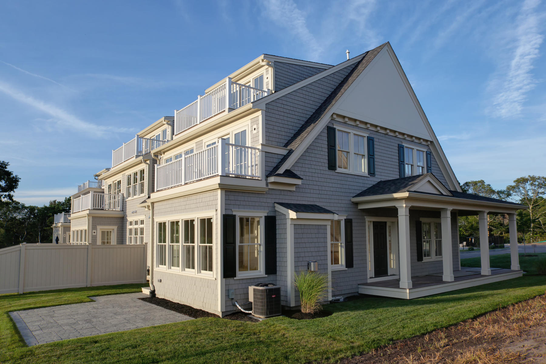 1090 Shore Road, Unit 2 Pocasset, MA 02559 - Photo 25 of 28 a front view of a house with a yard