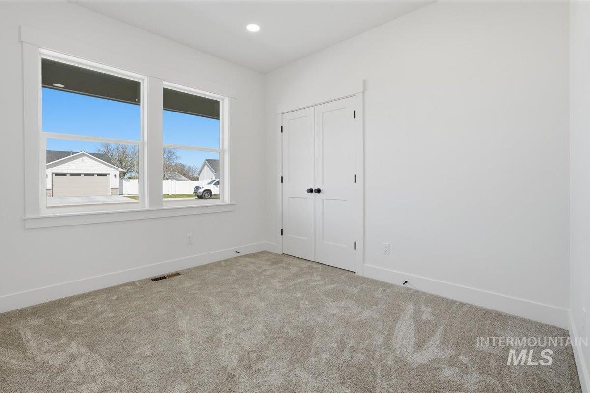 2175 Austin Way Fruitland, ID 83619 - Photo 10 of 30 Unfurnished bedroom featuring carpet, a closet, and recessed lighting