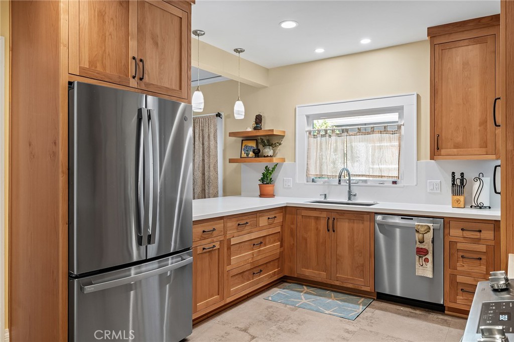 587 East 3rd Street Chico, CA 95928 - Photo 21 of 73 a kitchen with stainless steel appliances granite countertop a refrigerator and a sink