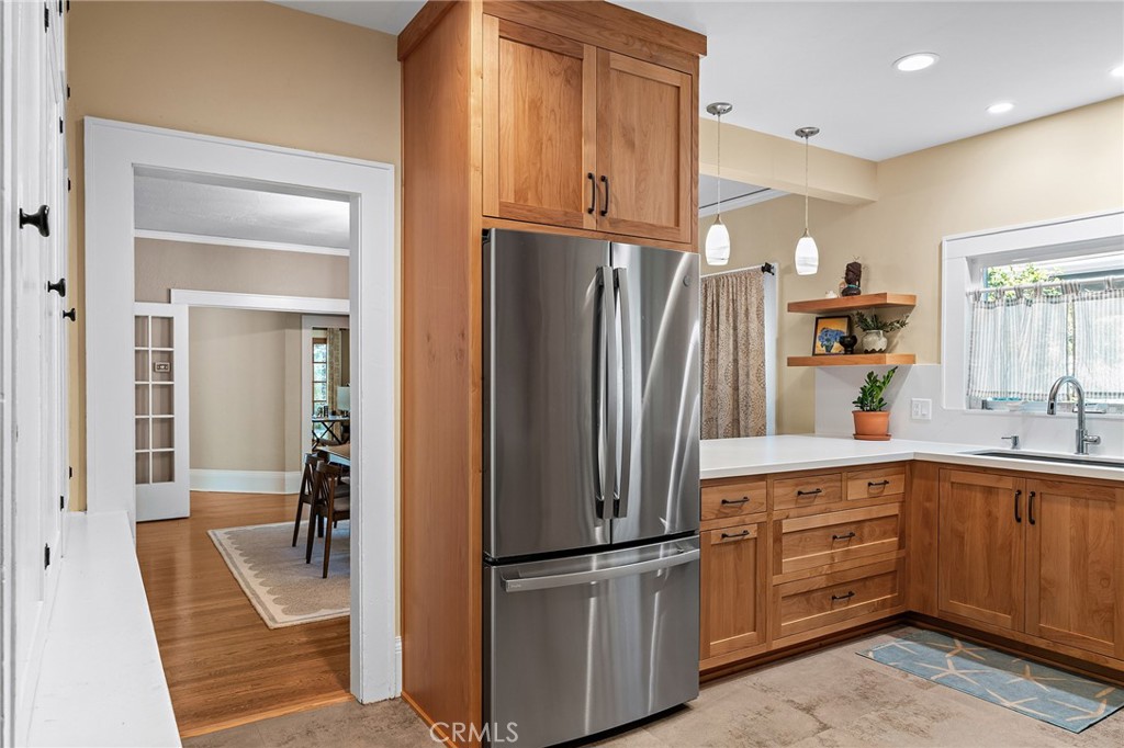 587 East 3rd Street Chico, CA 95928 - Photo 22 of 73 a kitchen with refrigerator and cabinets