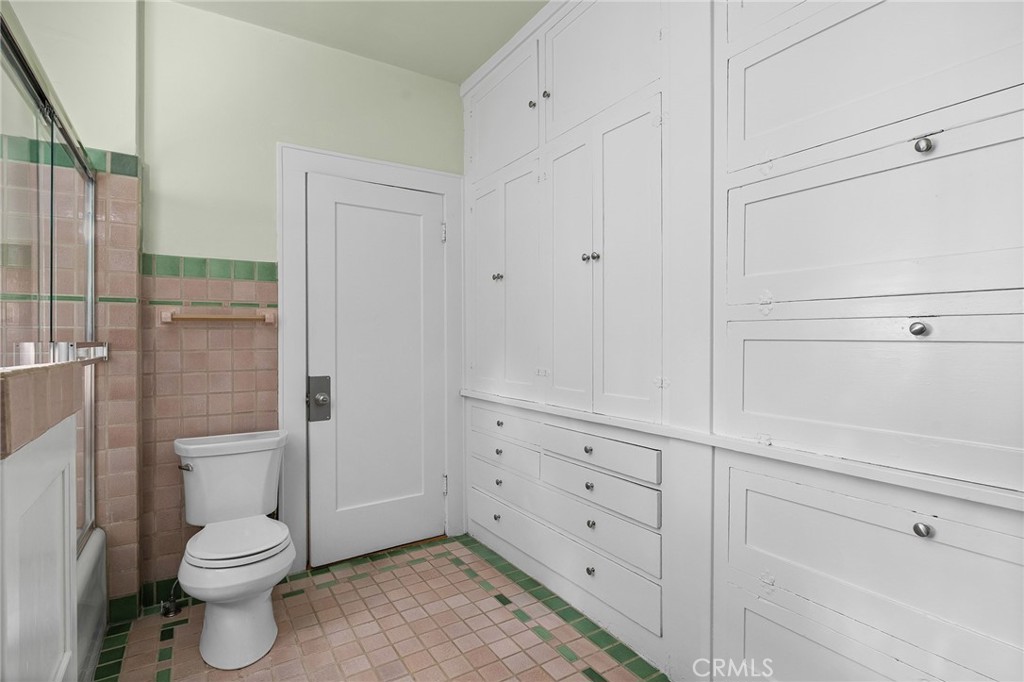587 East 3rd Street Chico, CA 95928 - Photo 34 of 73 a bathroom with a toilet and a shower