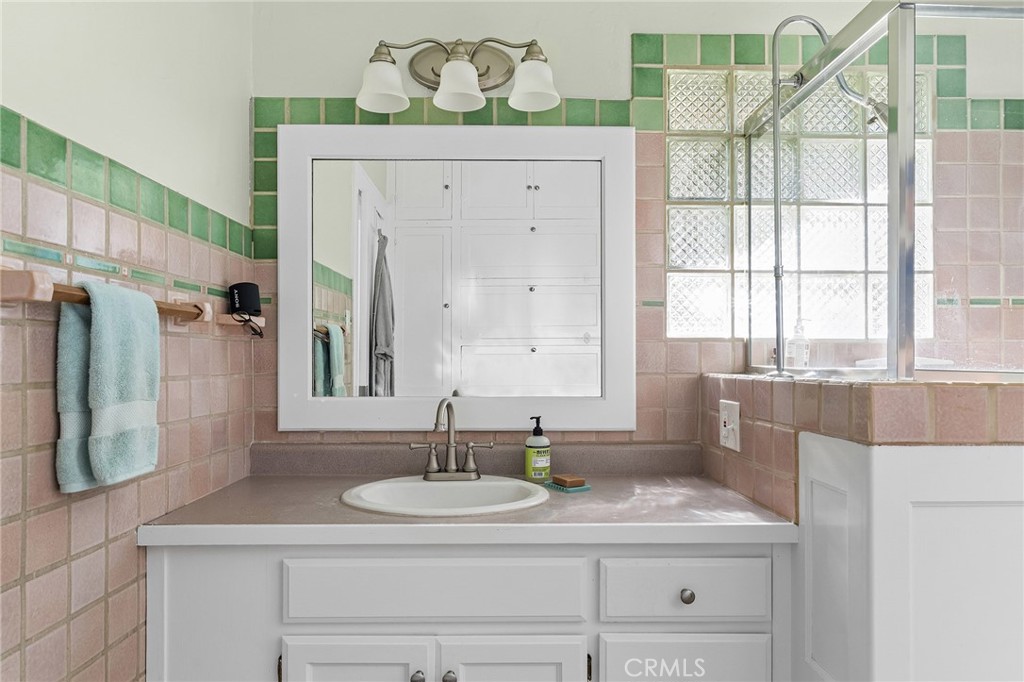 587 East 3rd Street Chico, CA 95928 - Photo 35 of 73 a bathroom with a granite countertop sink and a mirror
