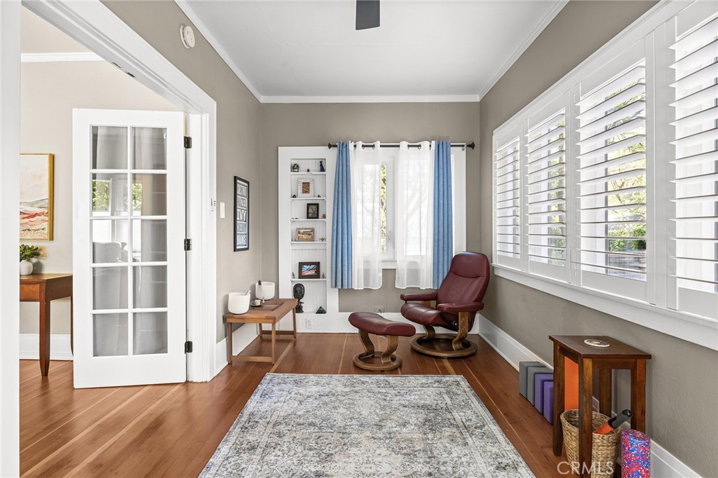 587 East 3rd Street Chico, CA 95928 - Photo 40 of 73 a living room with furniture floor to ceiling window and wooden floor