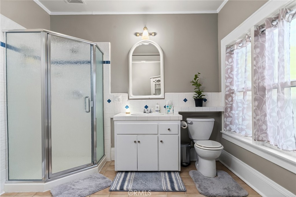 587 East 3rd Street Chico, CA 95928 - Photo 41 of 73 a spacious bathroom with a toilet sink and mirror