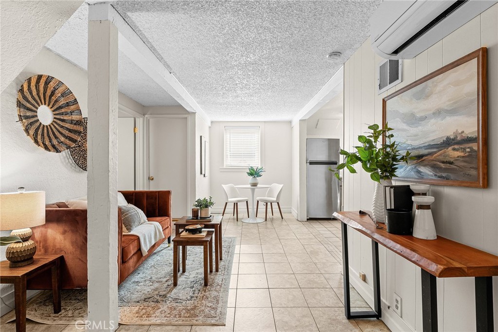 587 East 3rd Street Chico, CA 95928 - Photo 5 of 73 a living room with furniture a potted plant and a chair