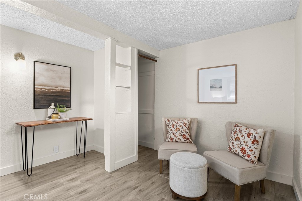 587 East 3rd Street Chico, CA 95928 - Photo 55 of 73 a living room with furniture and a wooden floor