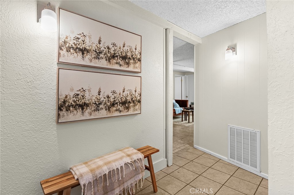 587 East 3rd Street Chico, CA 95928 - Photo 57 of 73 a bedroom with a bed and a painting on the wall