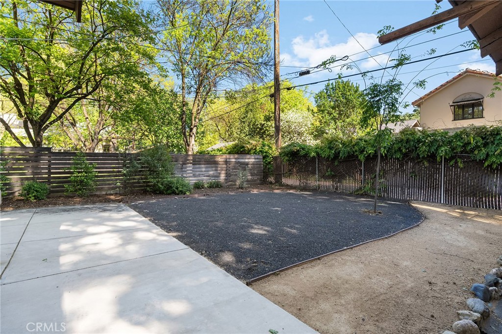587 East 3rd Street Chico, CA 95928 - Photo 63 of 73 a view of a yard with plants and a table and chair