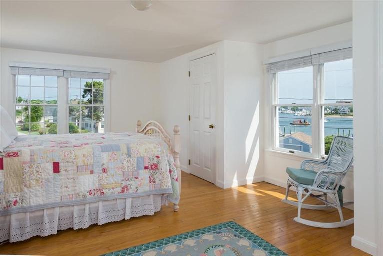 165 Bay Shore Road Hyannis, MA 02601 - Photo 11 of 26 a white bed sitting in a bedroom next to a window