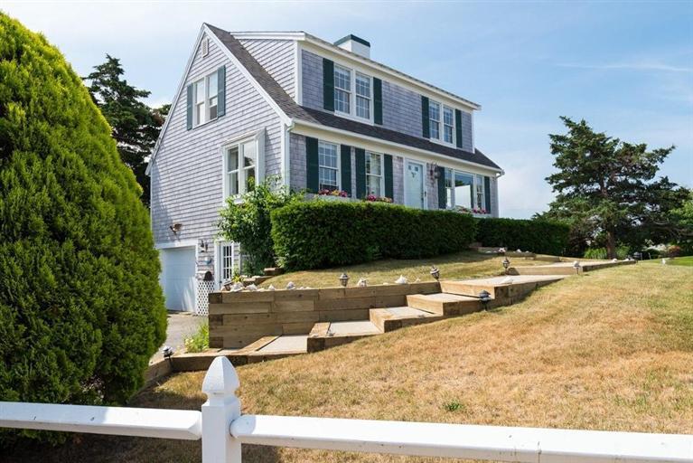 165 Bay Shore Road Hyannis, MA 02601 - Photo 20 of 26 a front view of a house with a yard