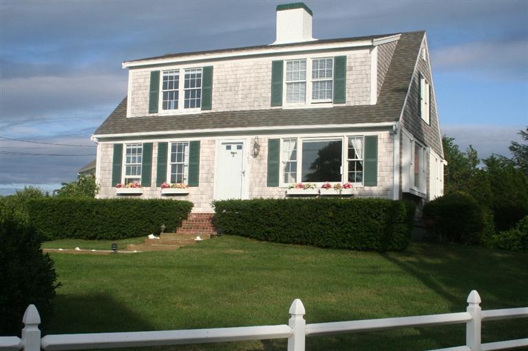 165 Bay Shore Road Hyannis, MA 02601 - Photo 2 of 26 a front view of a house with a yard