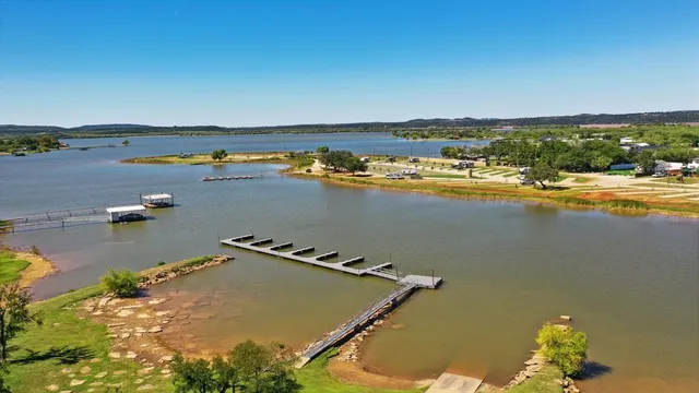 an aerial view of residential building and lake